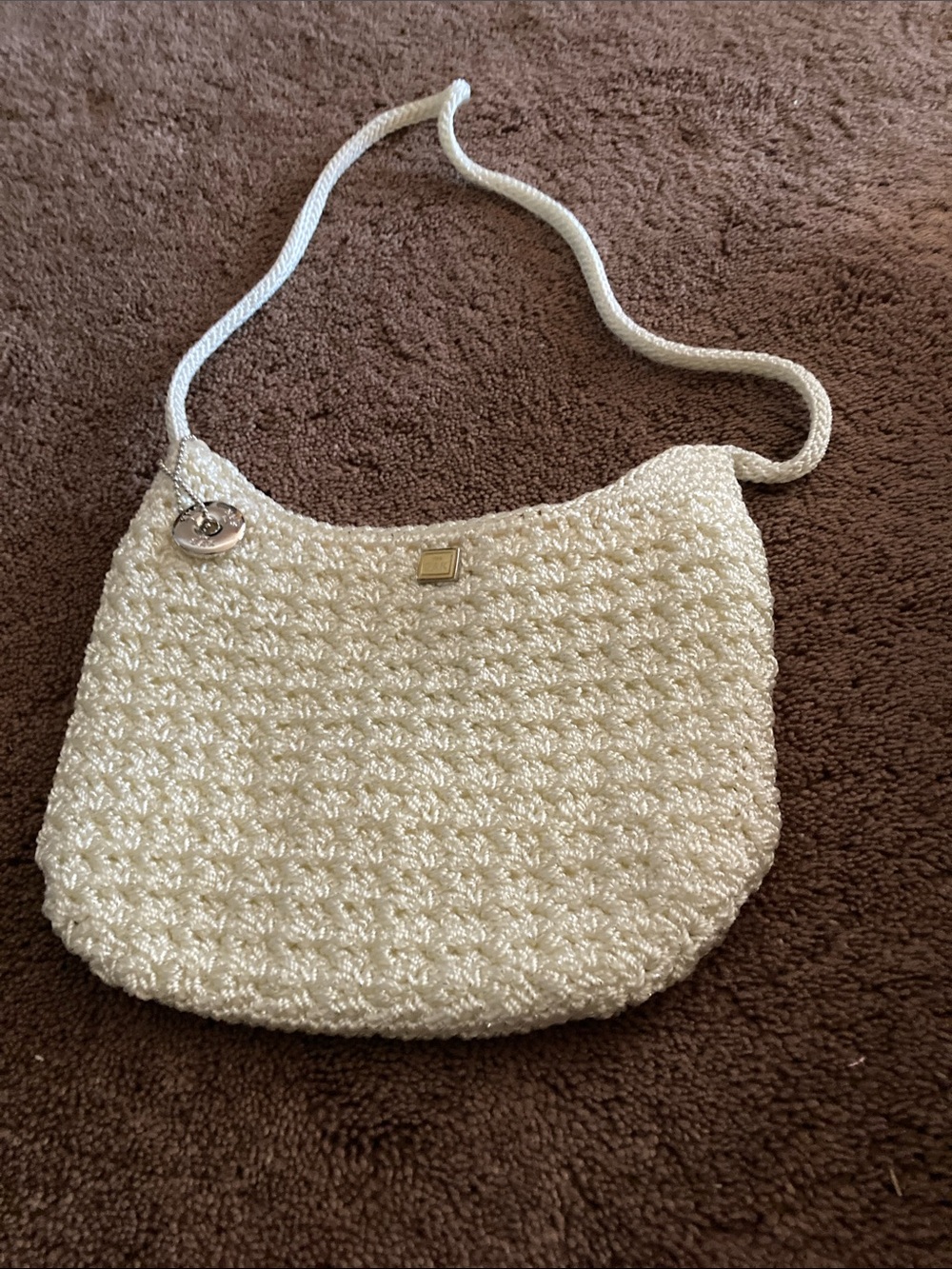 The Sak Cream Crochet Shoulder Bag with Rope Strap and Gold Accent